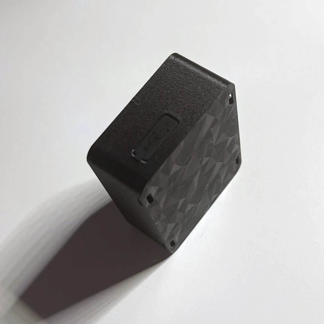 Real photo of the silicone plug over the charging port