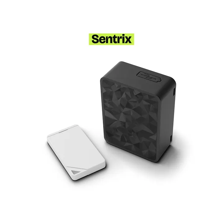 Sentrix tracker standing upright with its white Bluetooth fob in front of it