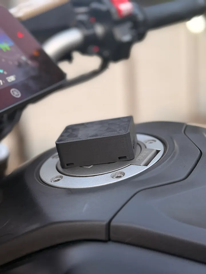 Sentrix on a motorbike’s fuel cap, with the dashboard and handlebars behind